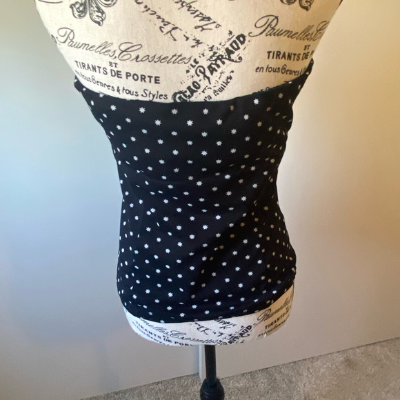 A strapless top with little tiny stars all over it. Ruffled front. - Picture 4 of 7